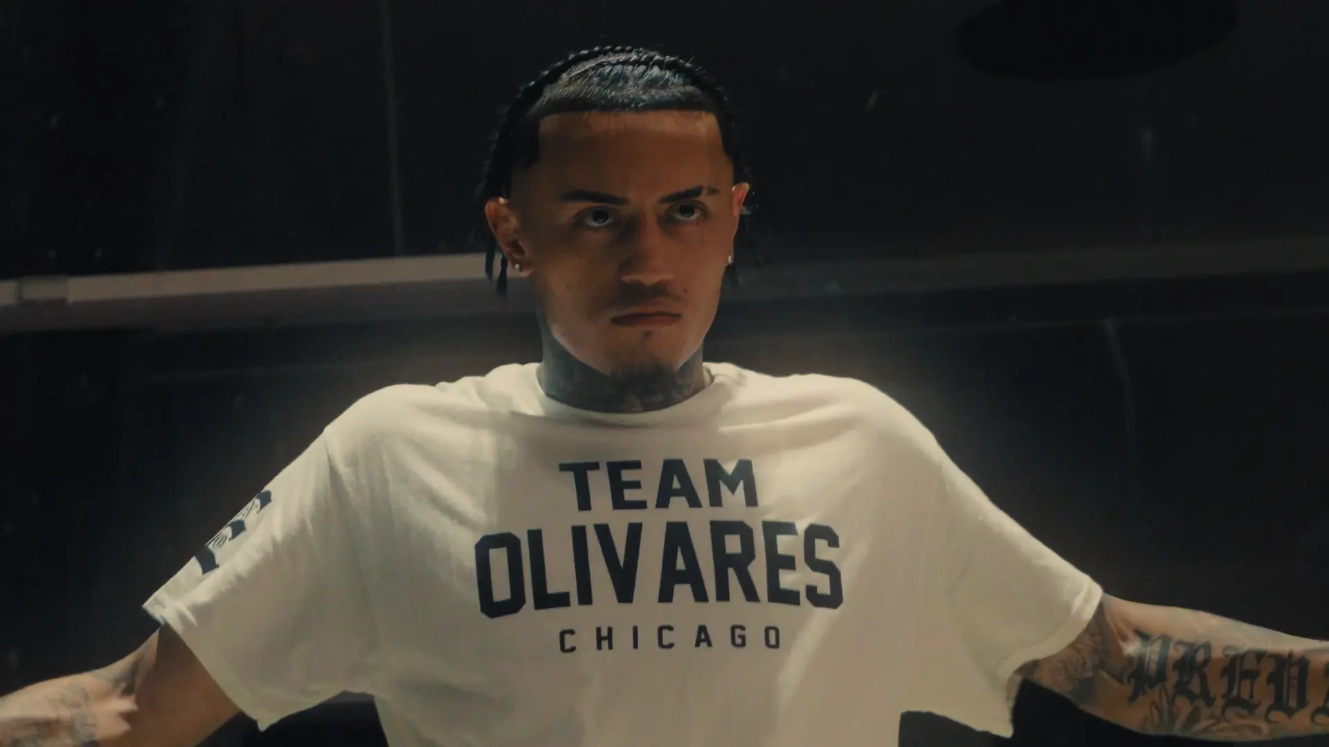 Boxer wearing a Team Olivares Chicago shirt in the ring